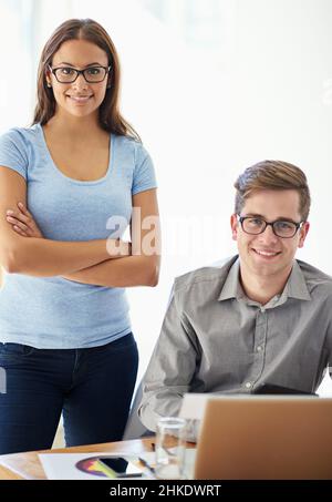 They're top graphic designers. Portrait of two young designers working together in their office. Stock Photo