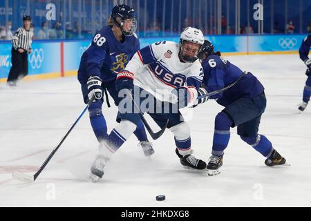 Beijing, China. 3rd Feb, 2022. Alex Carpenter (25) of Team United States goes for the puck against Jenni Hiirikoski (6) of Team Finland and Ronja Savolainen (88) of Team Finland in a women's ice hockey Group A match during the Beijing 2022 Olympic Winter Games at Wukesong Sports Centre. (Credit Image: © David G. McIntyreZUMA Press Wire) Credit: ZUMA Press, Inc./Alamy Live News Stock Photo