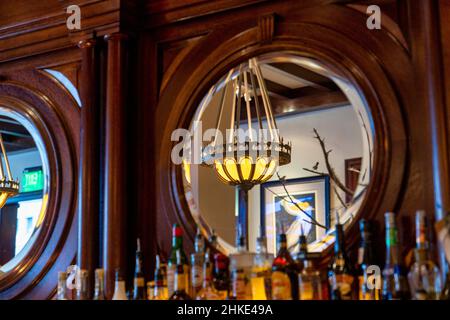 Mirror behind the bar Stock Photo