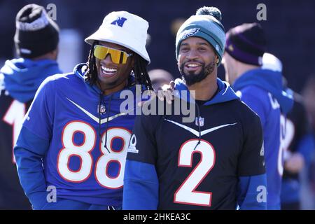 NFC wide receiver CeeDee Lamb of the Dallas Cowboys tosses a ball to a  teammate during Pro Bowl NFL football practice, Friday, February 4, 2022,  in Las Vegas. (Gregory Payan/AP Images for