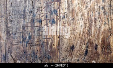 close-up of ancient wooden board ruined by knife furrows Stock Photo