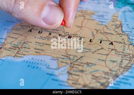 Australia pin on a world map. Australia travel destination planning pinned Stock Photo
