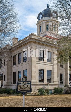 Poinsett County Courthouse in Harrisburg, Arkansas, with Civil War historical marker noting the site of the Confederate Headquarters in Harrisburg. Stock Photo