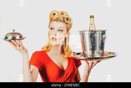 Restaurant waiter. Pinup girl with service tray. Serving presentation concept. Stock Photo