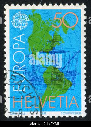 SWITZERLAND - CIRCA 1992: stamp printed by Switzerland, shows Ship and map, circa 1992 Stock Photo