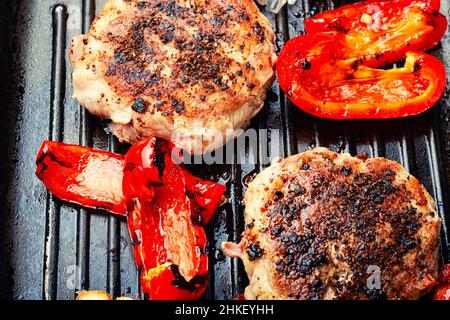 Grilled beef steak, beef and pork with spices. Fried meat cutlet in bacon. Stock Photo