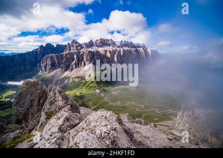 Aerial view on Gardena Pass, rock faces of Sella group and Piz Boe, seen from the summit of Grand Cir. Stock Photo