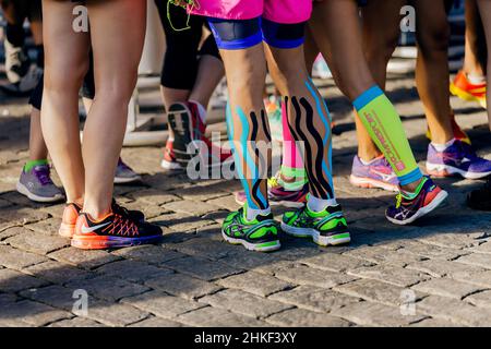 legs runner in compression calf sleeve running over stones Stock Photo -  Alamy