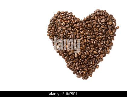 Heart from coffee beans. Coffee beans in heart shape white background isolated Stock Photo