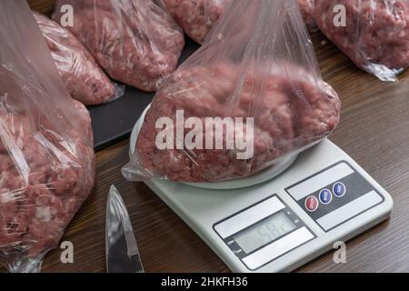 Scale with raw meat Stock Photo - Alamy