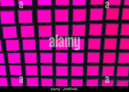 Pink neon vibrant square tiles modern background. Stock Photo