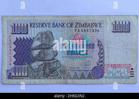 Money Zimbabwe one hundred dollar note currency history of  fiat  paper banking inflation obsolete vintage.