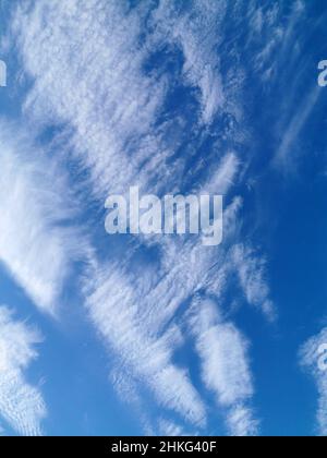 Blue sky with white spindrift clouds Stock Photo