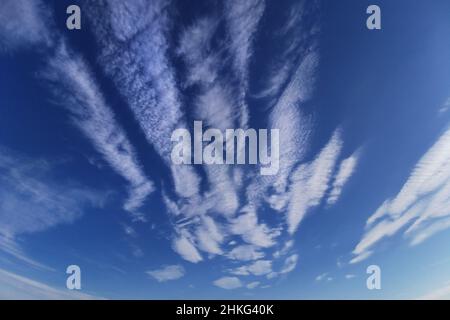 Blue sky with white spindrift clouds Stock Photo