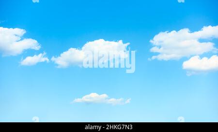 Idyllic blue sky with white clouds - background with copyspace Stock Photo