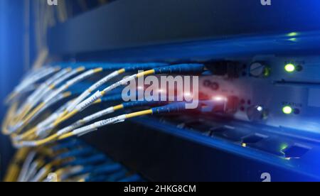 Close up fiber optic and hub in datacenter Stock Photo