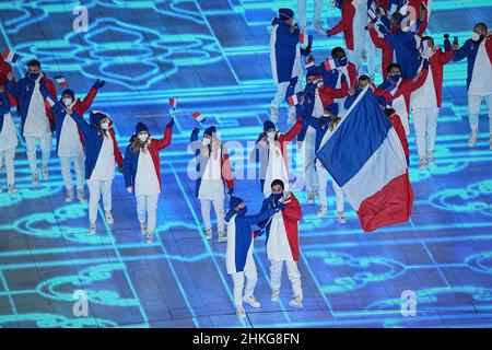 Beijing, China. 04th Feb, 2022. Olympics: Opening ceremony in the Olympic stadium 'Bird's Nest'. The team from France with flag bearers Tessa Worley and Kevin Rolland enters the stadium. Credit: Michael Kappeler/dpa/Alamy Live News Stock Photo