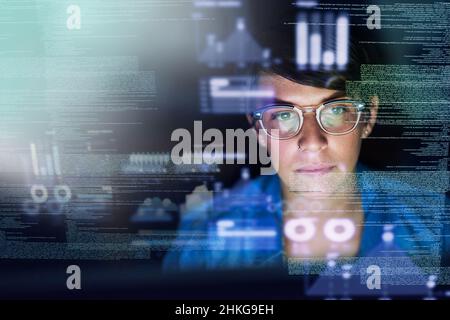 She's the best programmer around. Cropped shot of a young computer programmer looking through data. Stock Photo