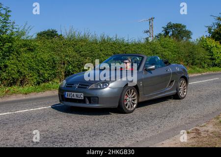 2004 grey MG TF 1796cc petrol 2dr convertible; en-route to Capesthorne Hall classic July car show, Cheshire, UK Stock Photo