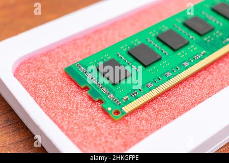 New computer RAM module on a red background close-up. Computer parts and products Stock Photo