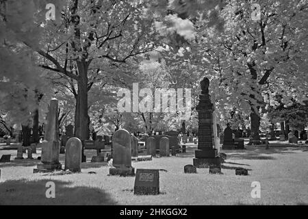 A very old cemetery in an 1776 English Reform Church yard. This infrared,abstract, Black and white photo is a scary and a good look for Halloween. Stock Photo