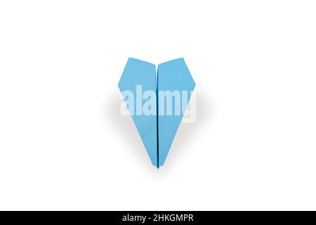 Top view of a blue paper airplane isolated on a white background Stock Photo