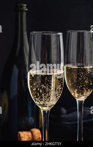 Closeup View of Champagne in Flute Glasses: Detail view of bubbly sparkling wine in champagne glasses Stock Photo