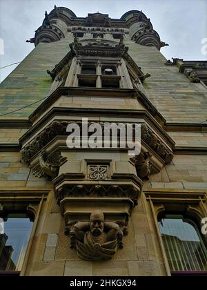 A view of the architectural detail of the historic old stone clock tower building in the town of Dunfermline. Stock Photo
