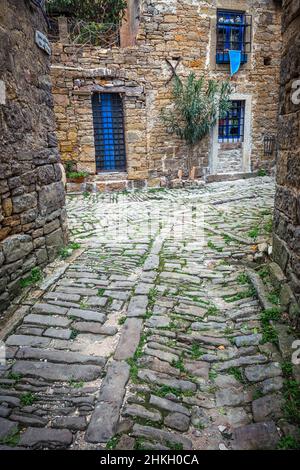 Stone facades of old houses in ancient streets. The Groznjan village on Istria in Croatia, Europe. Stock Photo
