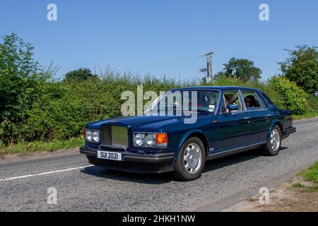 1987 80s eighties blue Bentley Turbo 6750cc petrol 3 speed automatic; en-route to Capesthorne Hall classic July car show, Cheshire, UK Stock Photo