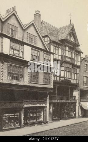 Antique circa 1890 photograph at 22 Bridge Street in Chester, England. Showing shops for The London Baker, Webb Howarth & Co., and Wood & Howitt Metalworkers. SOURCE: ORIGINAL ALBUMEN PHOTOGRAPH Stock Photo