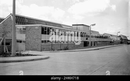 1960s, historical, exterior view of a newly built light industrial estate, near Didcot, Oxford, England, UK. The two-storey modern glass fronted buildings have distinctive triangular window roofs, an architectural design feature used in this era on many such engineering industrial units Stock Photo