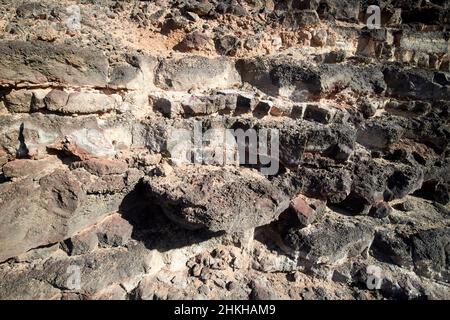 layers of volcanic rock strata inside the caldera of red montana roja ...