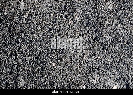 lose volcanic black stone gravel in the centre of the caldera red montana roja extinct volcano near playa blanca Lanzarote Canary Islands Spain Stock Photo