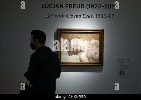 New York, USA. 04th Feb, 2022. A man walks past British artist Lucian Freud (1922-2011) painting titled “Girl with Closed Eyes” at Christie's 20/21 Shanghai to London sale preview, New York, NY, February 4, 2022. (Photo by Anthony Behar/Sipa USA) Credit: Sipa USA/Alamy Live News Stock Photo