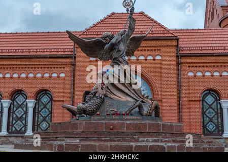 MINSK, BELARUS - November 08 Close up of statue of Archangel Michael with outstretched wings, thrusting spear into a dragon before Catholic Church of Stock Photo