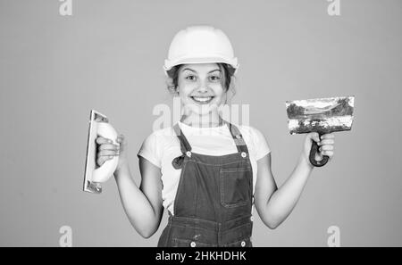 Welcome to my world. future engineer. happy kid use spatula repairing tool. building construction site. child architect worker. labor day concept Stock Photo