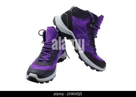 Men's winter boots with laces on a white background. Purple shoes made of rubber and suede close-up. Bright modern stylish footwear for the winter per Stock Photo