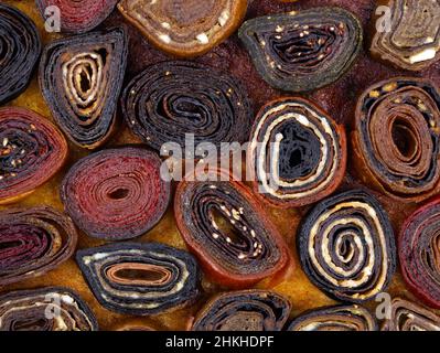 Sweets from fruit and berry pastille top view. Homemade fruit and berries paste close-up. confectionery product from dried fruit and berry puree or ju Stock Photo