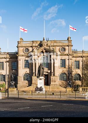 South Shields town hall designed by architect Ernst Fatch in Edwardian Baroque style and opened in 1910 flying flags of St George. Stock Photo