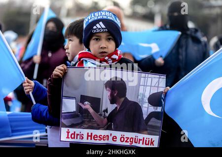 Istanbul, Turkey. 04th Feb, 2022. The son of Idris Hasan who is jailed in Morocco and faces extradition back to China, seen during the demonstration. Hundreds of Uyghurs living in Istanbul, Turkey protested close to the Chinese consulate calling for a boycott of the Winter Olympics in Beijing which opened Friday, February 4. Credit: SOPA Images Limited/Alamy Live News Stock Photo