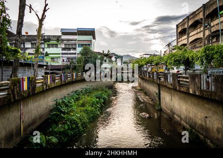 Betong, Thailand. 05th Feb, 2022. A view of a canal waterway in Betong. Daily life around Betong, Yala Province, Thailand. Located on the Thai-Malaysian border, Betong is flush with mixed cultures, colorful inflections, art, and lush jungle landscapes. Yala province has been under an emergency decree to quell violence stemming from religious and separatist insurgents for over a decade. Although the southernmost provinces remain under the emergency decree, Betong is preparing for tourism as it opens its first international airport this month. Credit: SOPA Images Limited/Alamy Live News Stock Photo