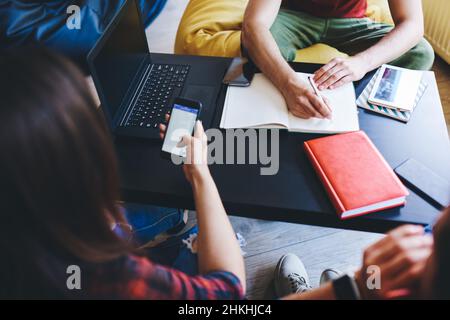 Students preparing for test sitting at table Stock Photo