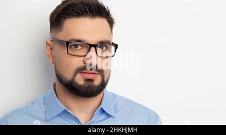 Portrait of a handsome business man in glasses with a beard on a white background. Stock Photo