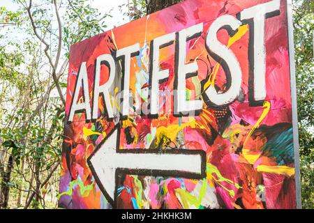 Miami Florida,Coconut Grove,Mad Hatter Arts Festival fair artfest arrow sign Stock Photo