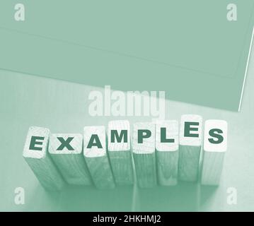 Examples word written on wooden blocks. Education or storytelling marketing concept. Stock Photo