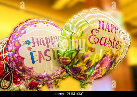 Pretty bright Easter Balloons against blurred background. Stock Photo