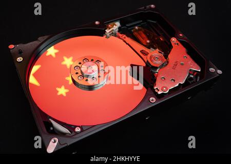 Chinese flag reflected on a disassembled HDD Stock Photo