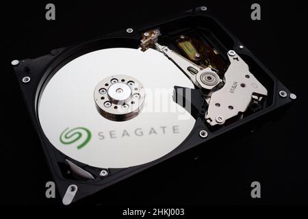 Seagate logo reflected on a disassembled HDD Stock Photo