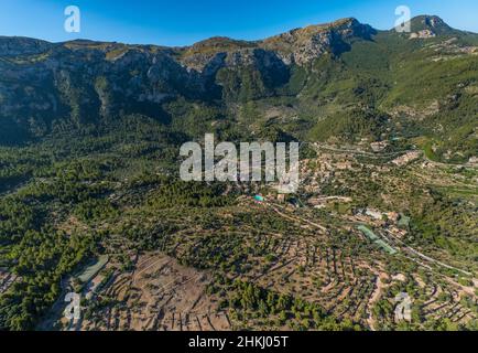 Aerial view, village view of Déjà on the mountainside with tennis courts, Deià, Majorca, Balearic Islands, Spain, ES, Europe, property tax, real estat Stock Photo